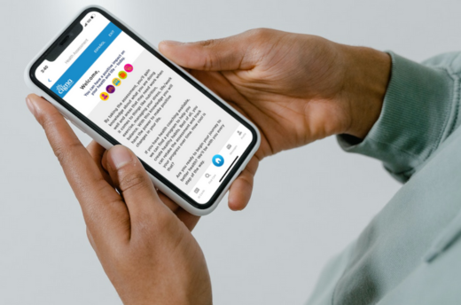 man's hand holding phone with the myCigna health assessment on the screen