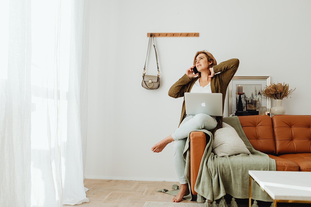 woman using laptop and phone in a peaceful environment