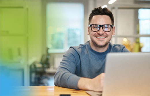 Man sitting at laptop computer